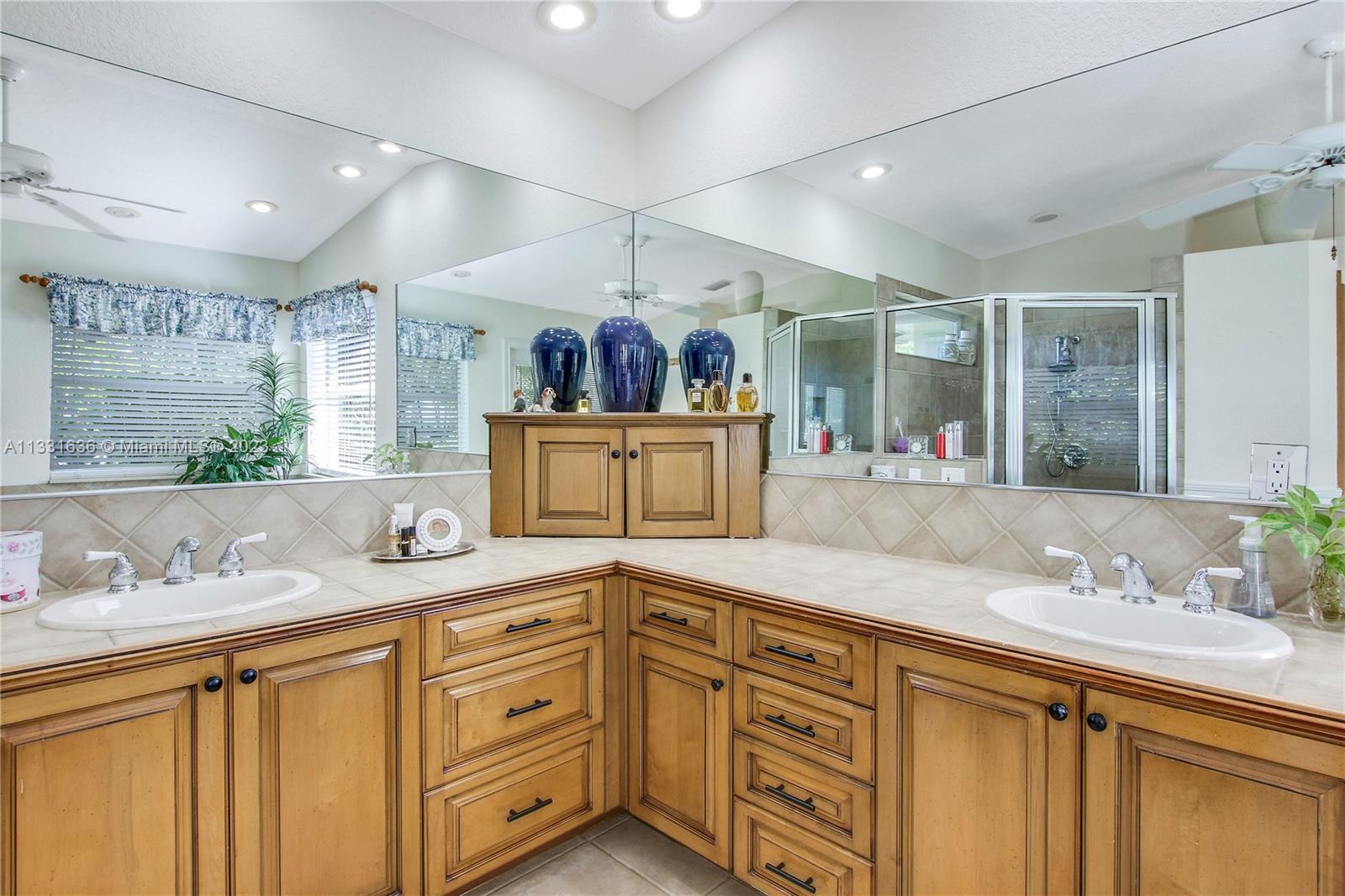 361 Zenith Lane Juno Beach, FL 33408 - Photo 11 of 36 a bathroom with a granite countertop sink mirror and