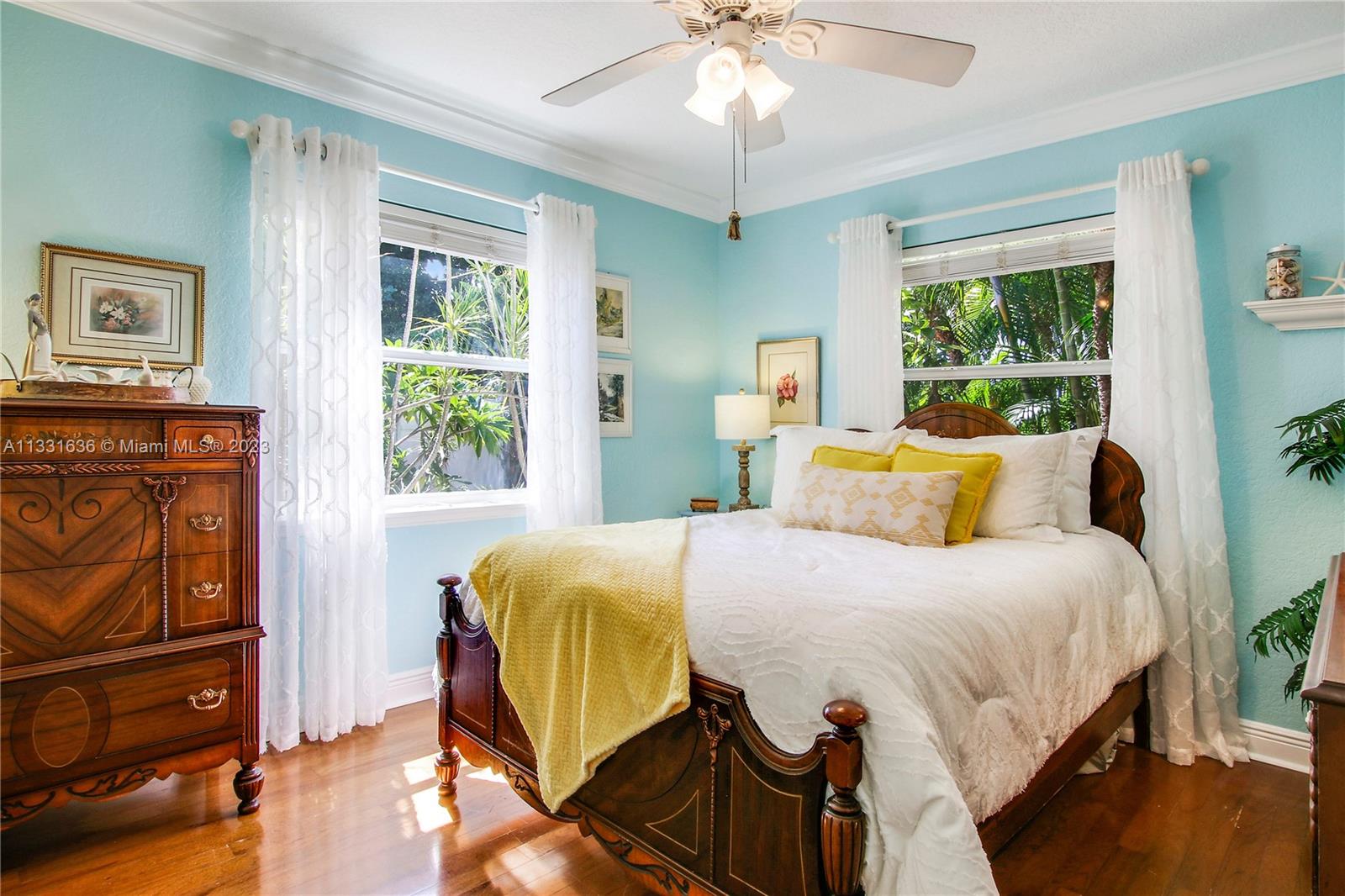 361 Zenith Lane Juno Beach, FL 33408 - Photo 13 of 36 a bedroom with a bed and wooden floor