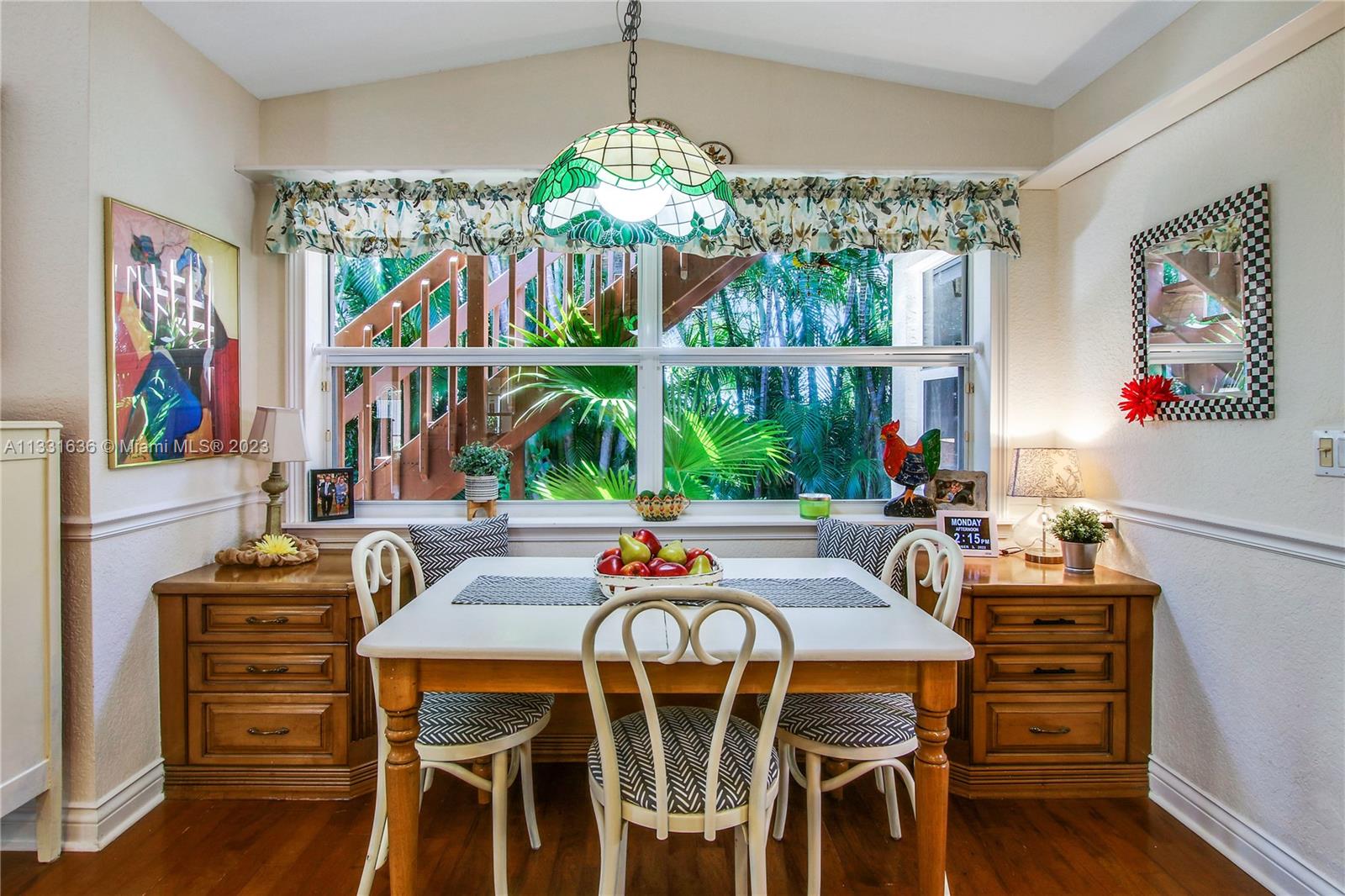 361 Zenith Lane Juno Beach, FL 33408 - Photo 18 of 36 a outdoor dining space with furniture one side kitchen view and wooden floor