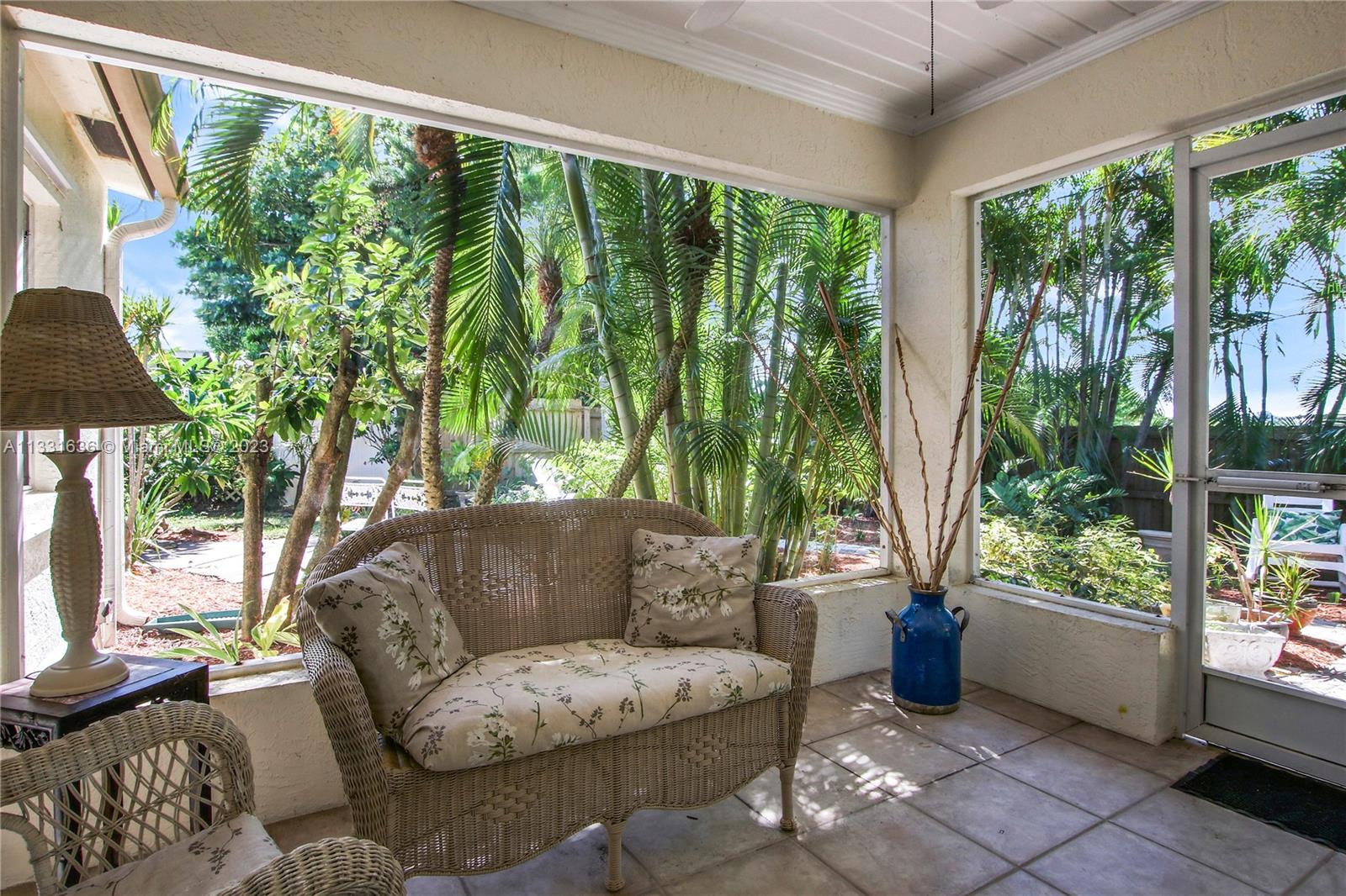 361 Zenith Lane Juno Beach, FL 33408 - Photo 25 of 36 a living room with furniture and a large window
