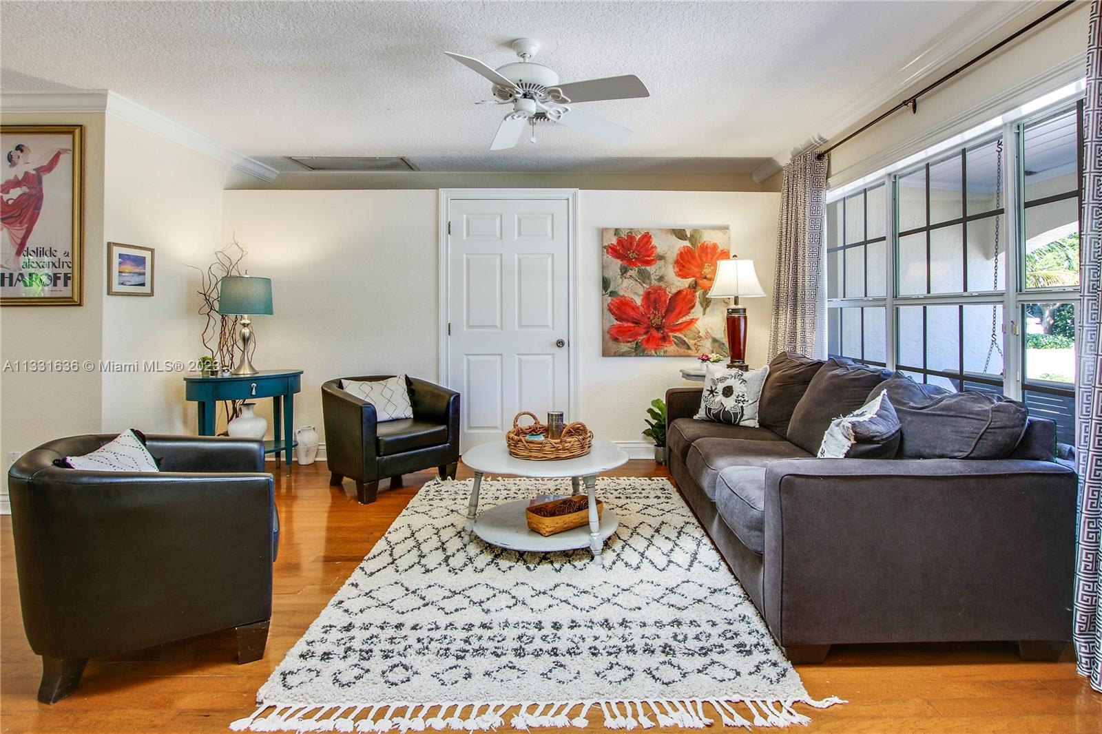 361 Zenith Lane Juno Beach, FL 33408 - Photo 5 of 36 a living room with furniture a rug and a window