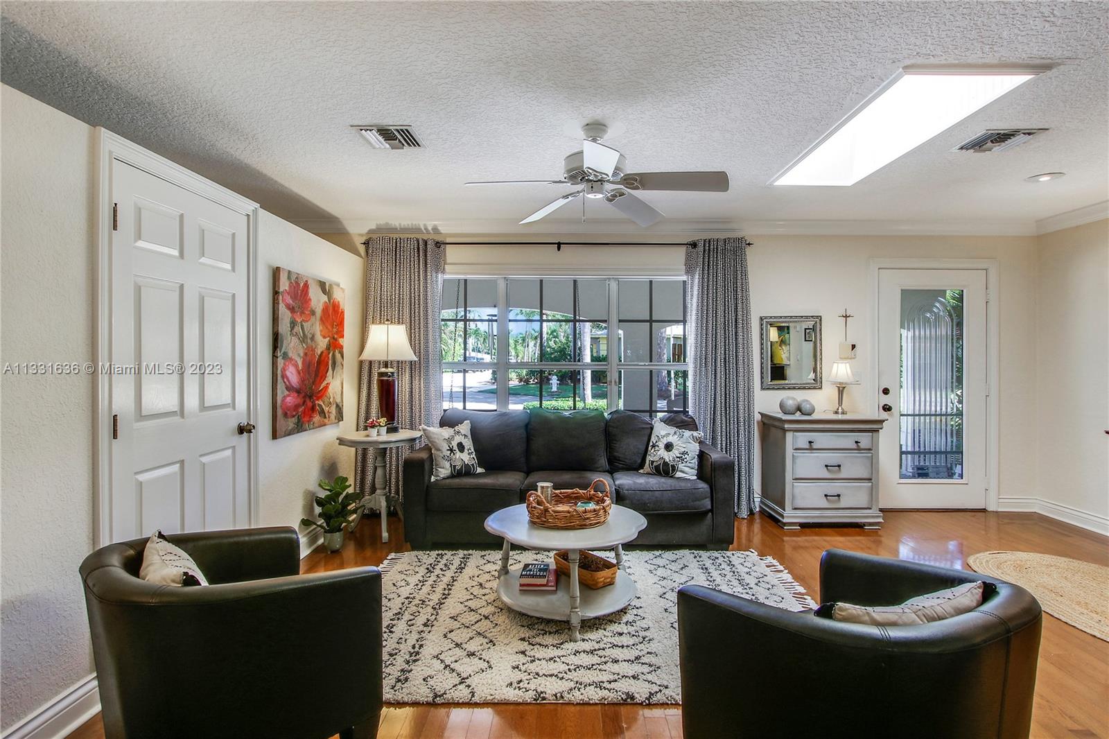 361 Zenith Lane Juno Beach, FL 33408 - Photo 7 of 36 a living room with fireplace furniture and a potted plant