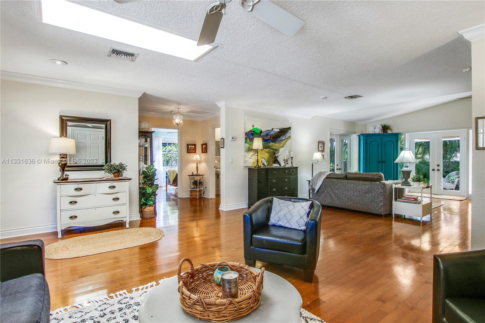 361 Zenith Lane Juno Beach, FL 33408 - Photo 8 of 36 a living room with furniture and a wooden floor
