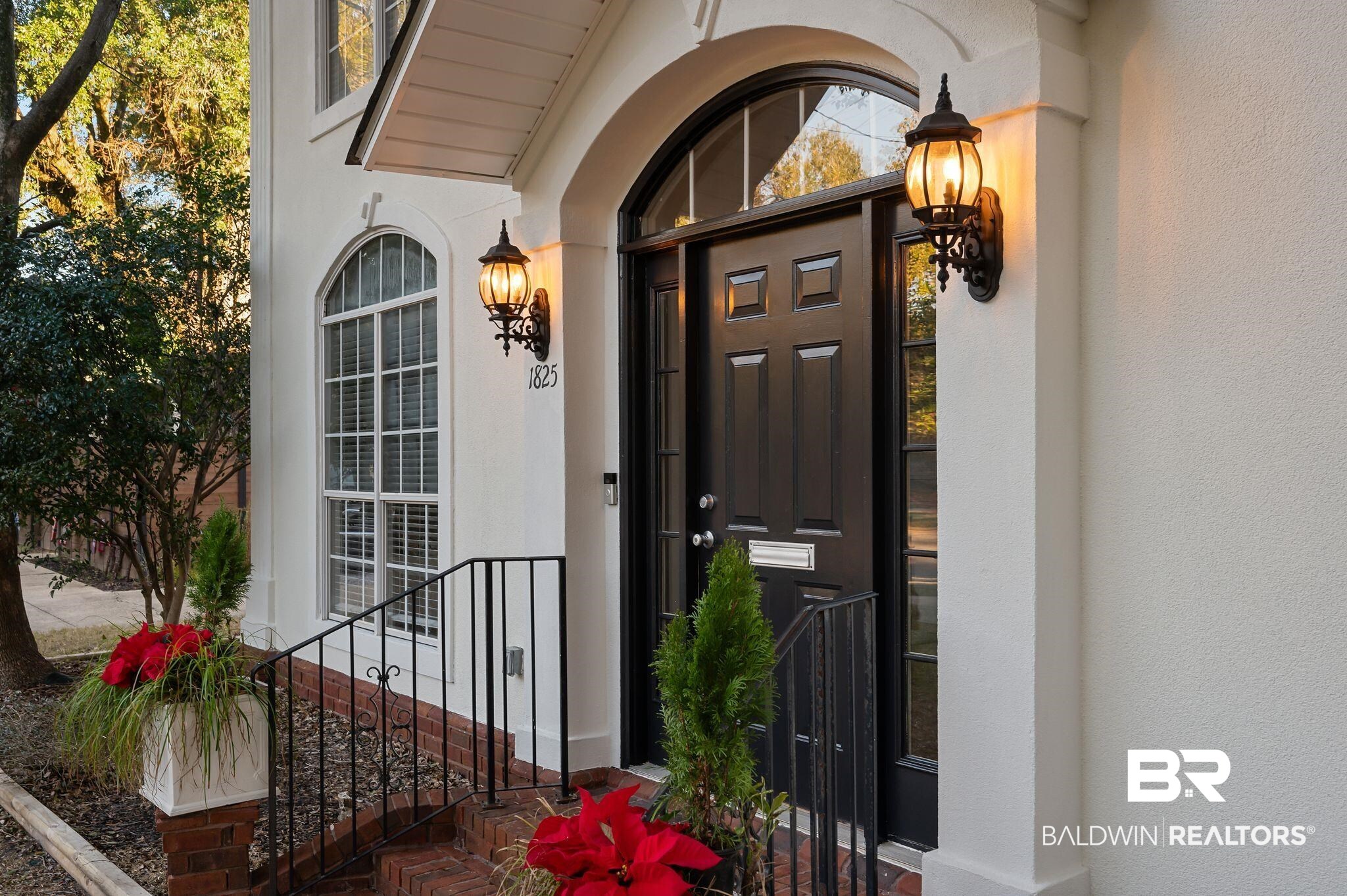 1825 Spring Hill Avenue Mobile, AL 36607 - Photo 4 of 43 Doorway to property with stucco siding