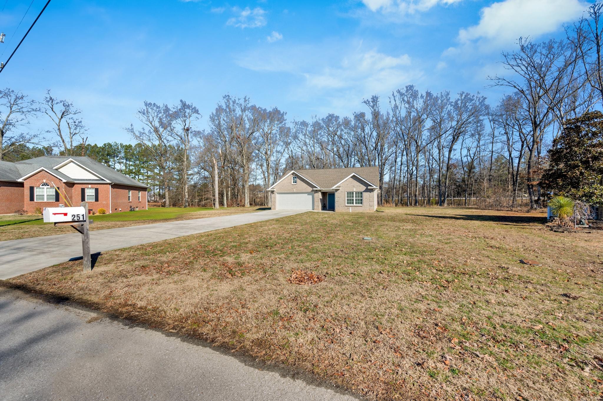 251 Oak Hollow Road Manchester, TN 37355 - Photo 3 of 28 a house with trees in the background