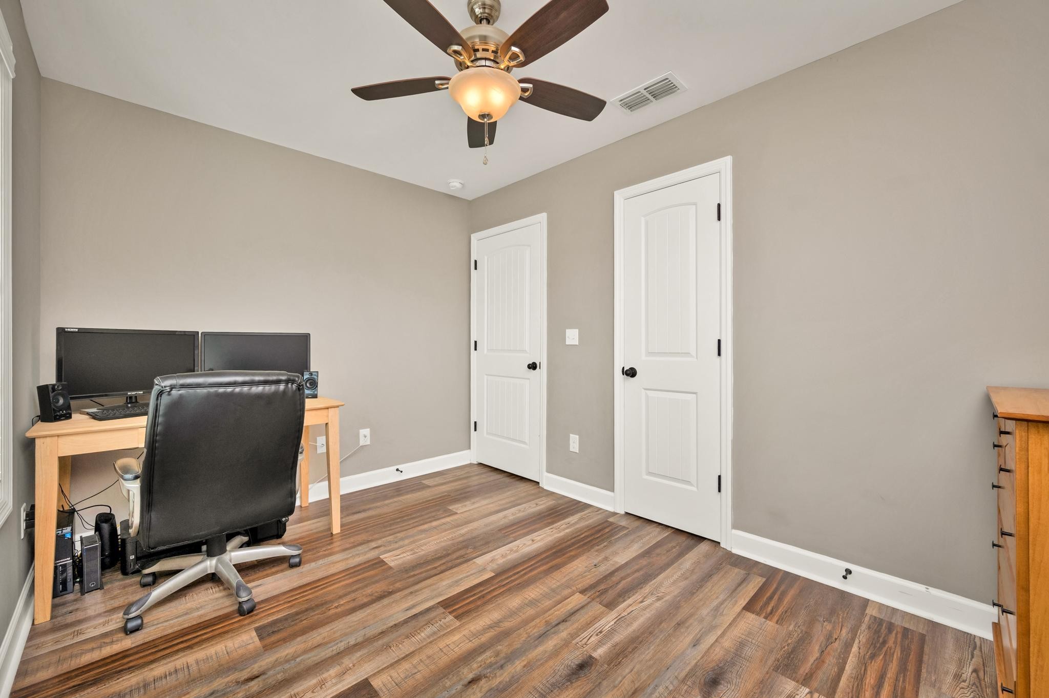 251 Oak Hollow Road Manchester, TN 37355 - Photo 8 of 28 a view of a workspace with furniture and a ceiling fan
