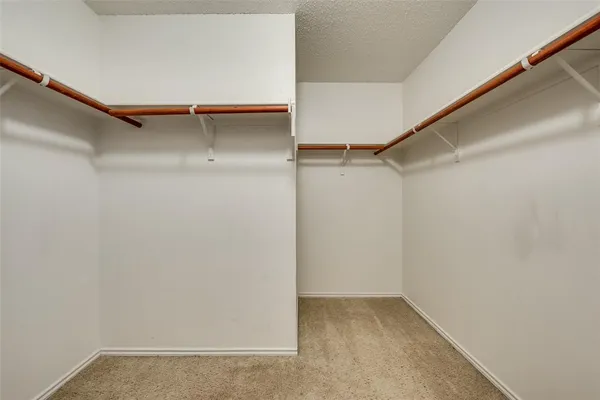 a bathroom with a sink and mirror with toilet