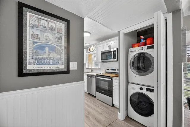 a kitchen with stainless steel appliances granite countertop a refrigerator stove and microwave