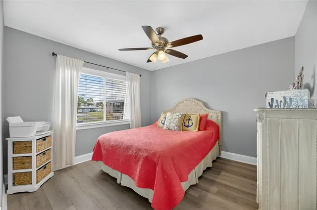 a bed room with a bed and a chandelier