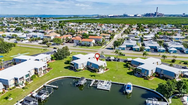 an aerial view of a house with garden space and street view