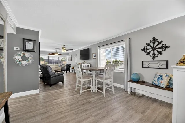 a dining room with furniture and window