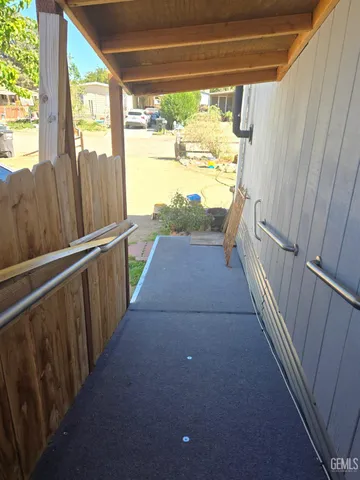 a view of balcony with wooden floor
