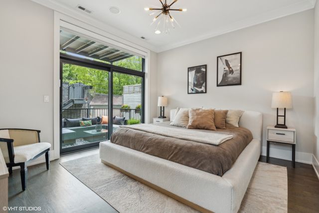 a spacious bedroom with a large bed and a couch