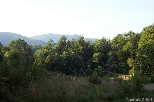 Lot R-7 Lot R-7 Cisco Cove Waynesville, NC 28785 - Photo 3 of 5 a view of a city with lush green forest