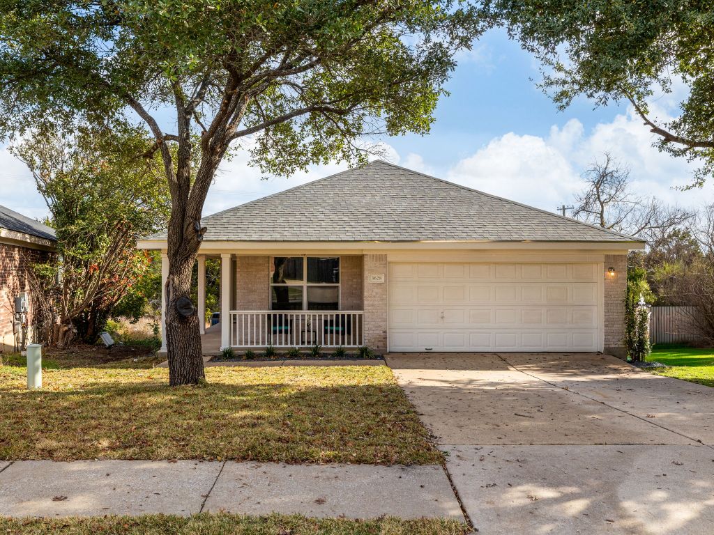 3628 Windhill Loop Round Rock, TX 78681 - Photo 1 of 24 a front view of a house with a yard and garage