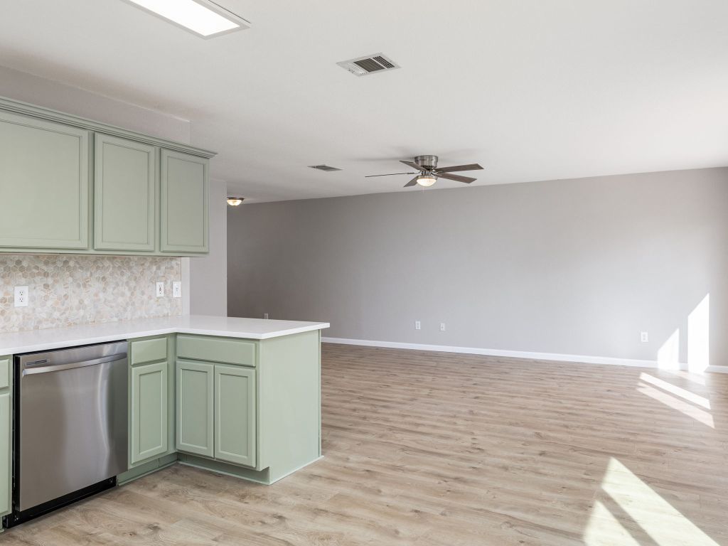 3628 Windhill Loop Round Rock, TX 78681 - Photo 13 of 24 a kitchen with a sink and cabinets