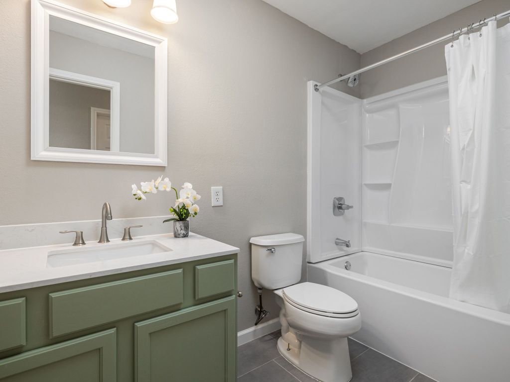 3628 Windhill Loop Round Rock, TX 78681 - Photo 19 of 24 a bathroom with a sink toilet and shower