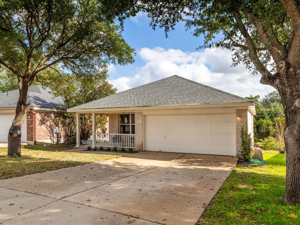 3628 Windhill Loop Round Rock, TX 78681 - Photo 2 of 24 a front view of a house with a yard