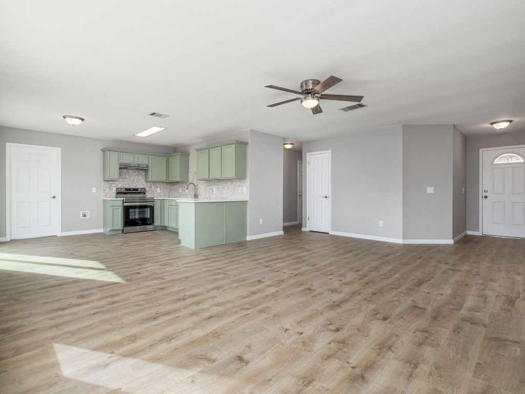 3628 Windhill Loop Round Rock, TX 78681 - Photo 5 of 24 a view of a kitchen with a sink and a kitchen counter space