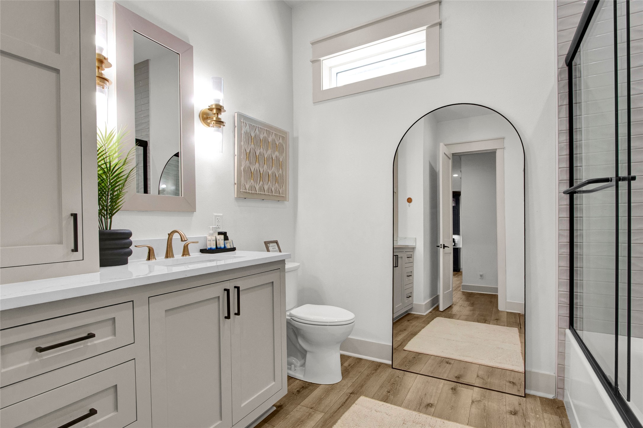 2906 Shady Lane Crystal Beach, TX 77650 - Photo 12 of 35 a spacious bathroom with a granite countertop sink a toilet and a mirror