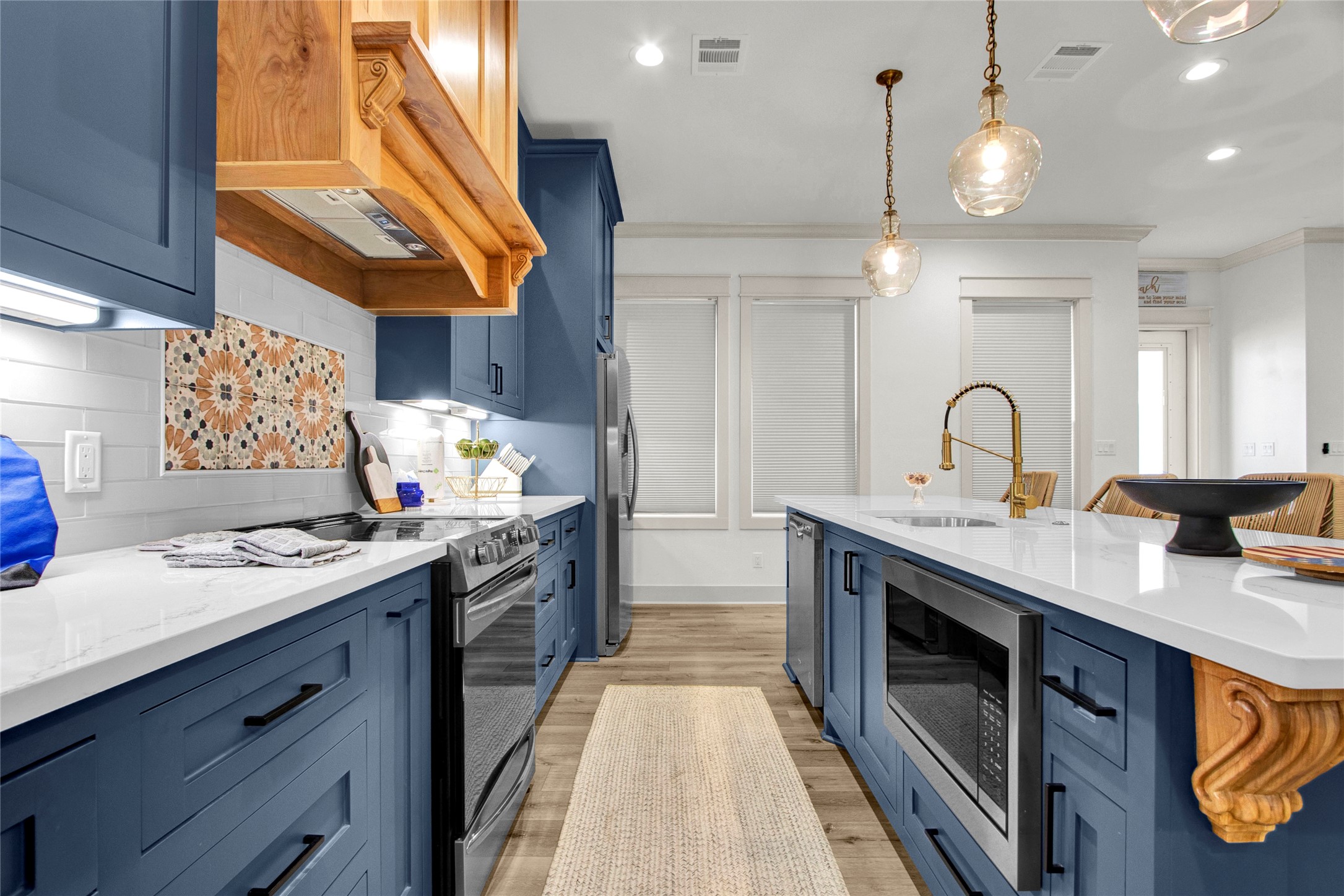 2906 Shady Lane Crystal Beach, TX 77650 - Photo 6 of 35 a kitchen with a sink stove and cabinets