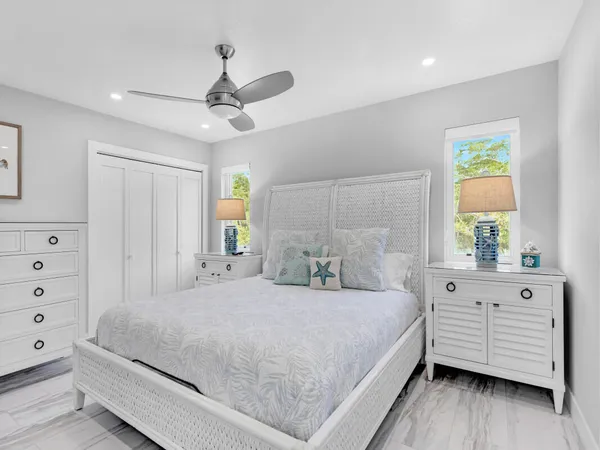 a bedroom with a large bed and a window
