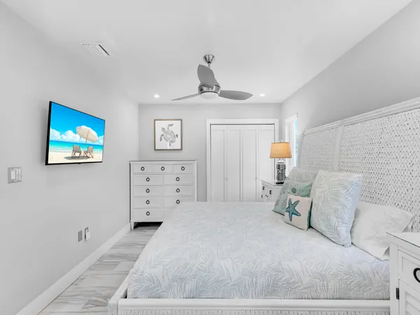 a bedroom with a large bed and a window