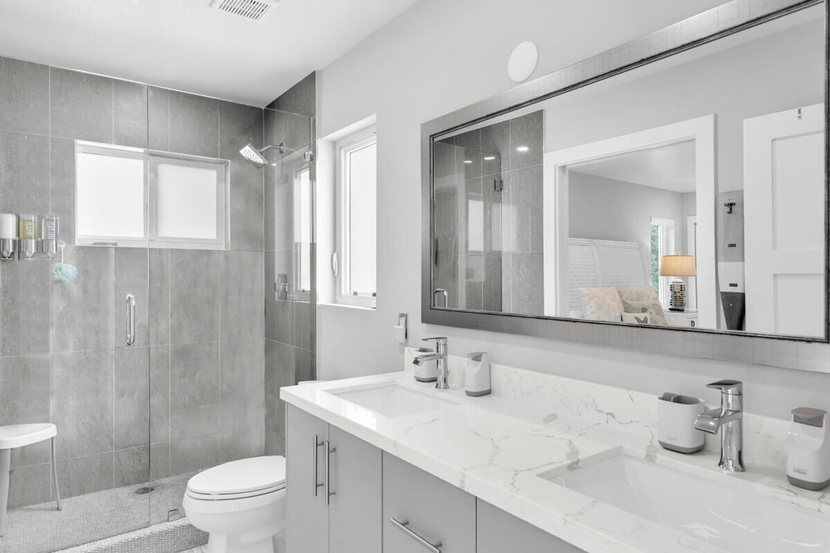 325 Calusa Street, Unit 359 Key Largo, FL 33037 - Photo 15 of 52 a bathroom with a sink a toilet and shower