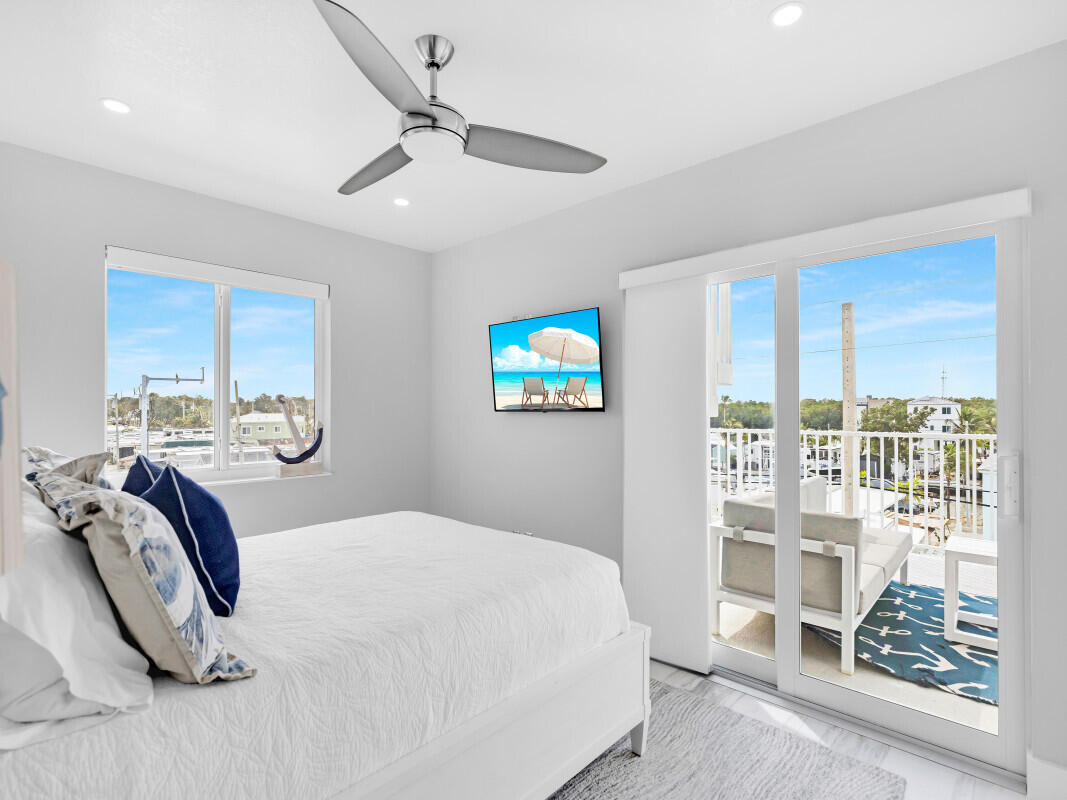 325 Calusa Street, Unit 359 Key Largo, FL 33037 - Photo 16 of 52 a bedroom with a bed and a window