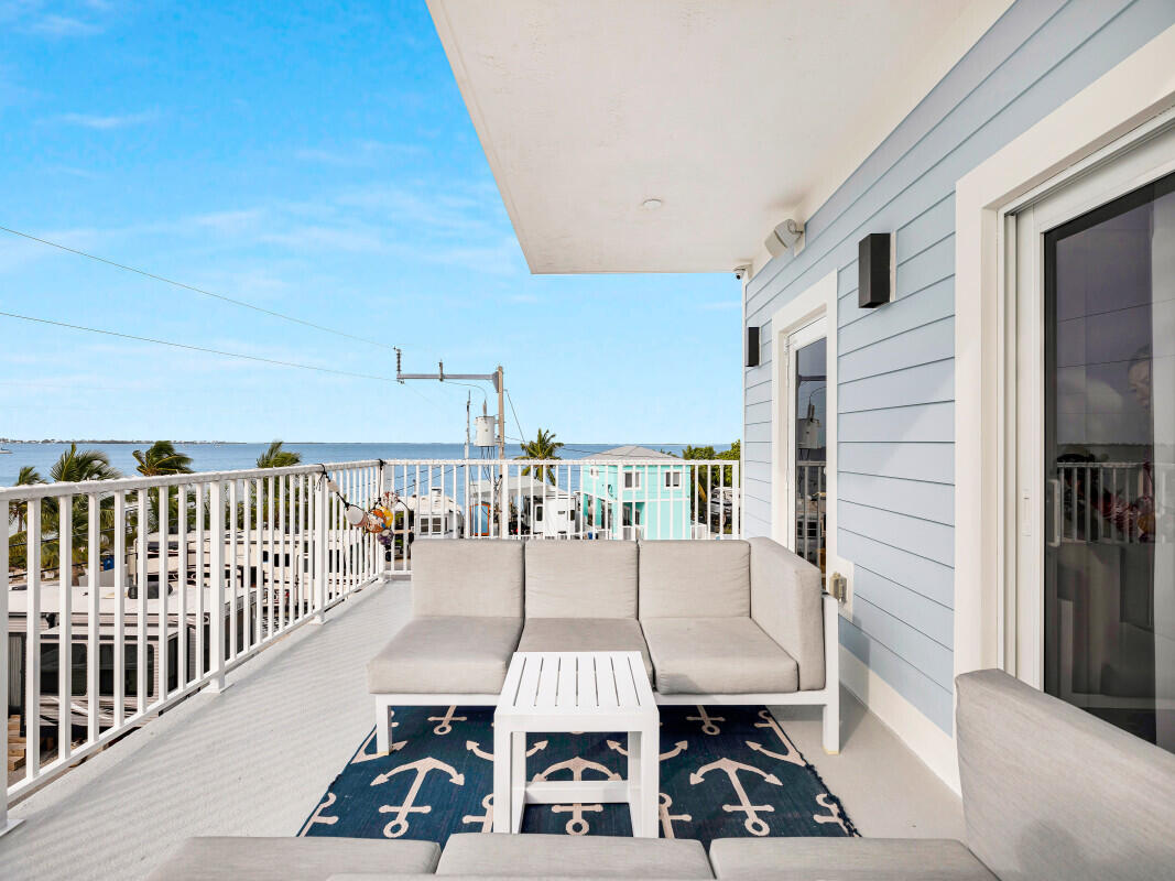 325 Calusa Street, Unit 359 Key Largo, FL 33037 - Photo 27 of 52 a view of a balcony with furniture