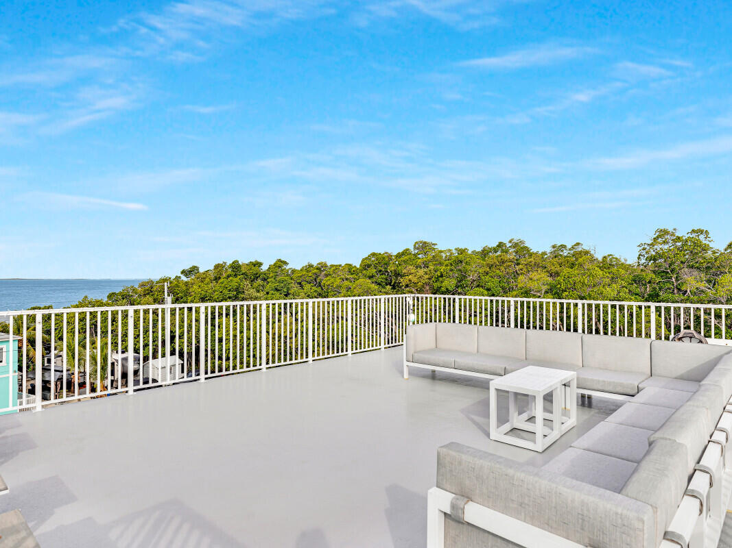 325 Calusa Street, Unit 359 Key Largo, FL 33037 - Photo 29 of 52 a view of a balcony with two chairs