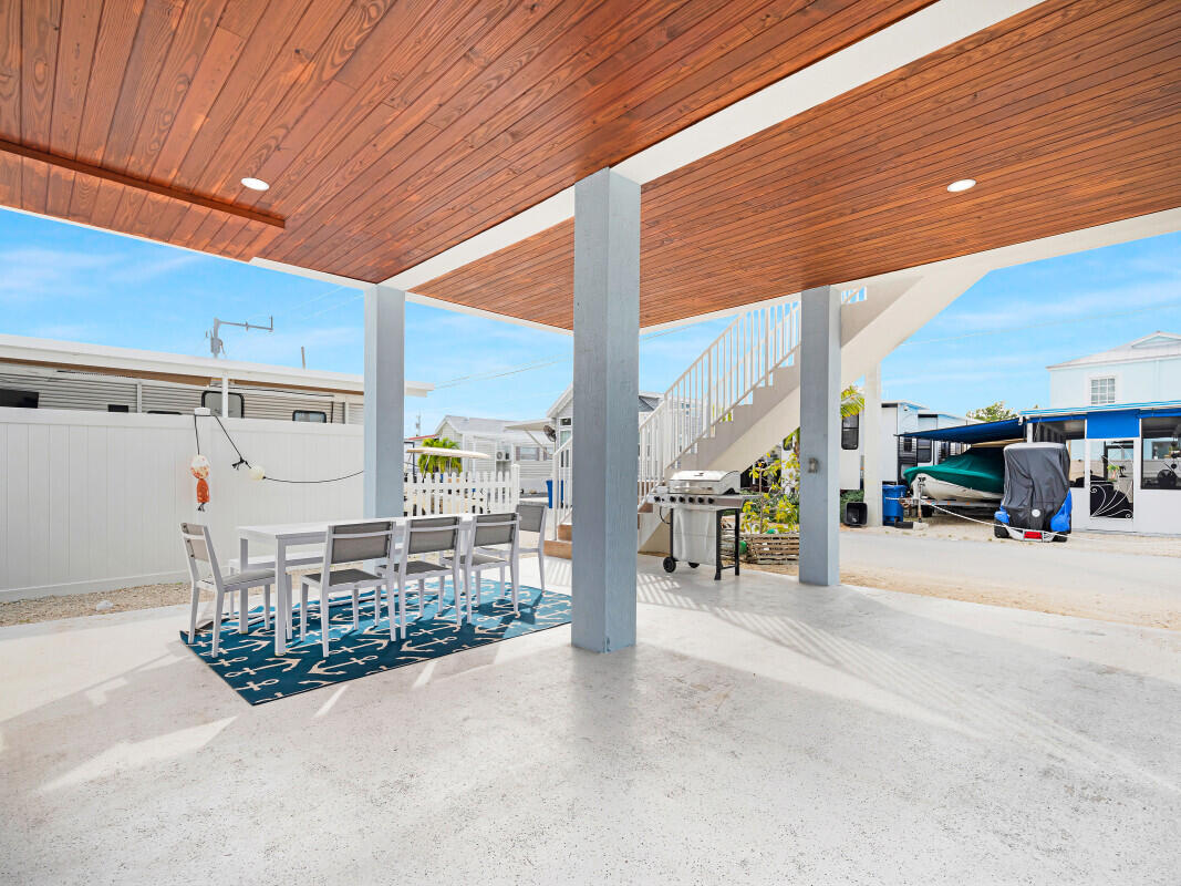 325 Calusa Street, Unit 359 Key Largo, FL 33037 - Photo 35 of 52 a view of a patio with table and chairs