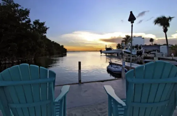 a view of a patio with iron fence