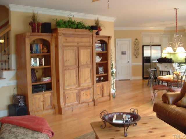 10525 Charmford Way Raleigh, NC 27615 - Photo 12 of 12 a living room with furniture a rug and kitchen view