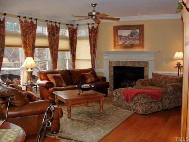 10525 Charmford Way Raleigh, NC 27615 - Photo 2 of 12 a living room with furniture and a fireplace