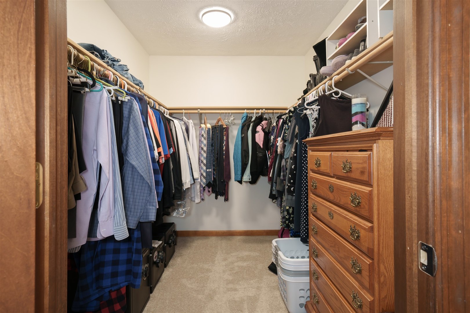 704 Franklin Way Pontiac, IL 61764 - Photo 12 of 39 a view of walk in closet with clothes and shoes