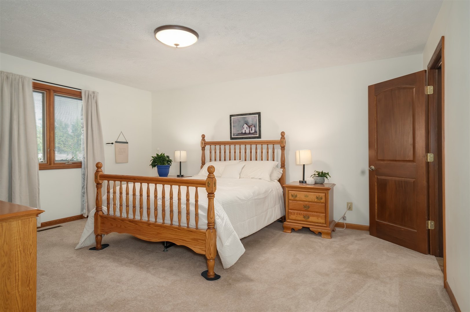 704 Franklin Way Pontiac, IL 61764 - Photo 13 of 39 a bed room with a bed and a chair