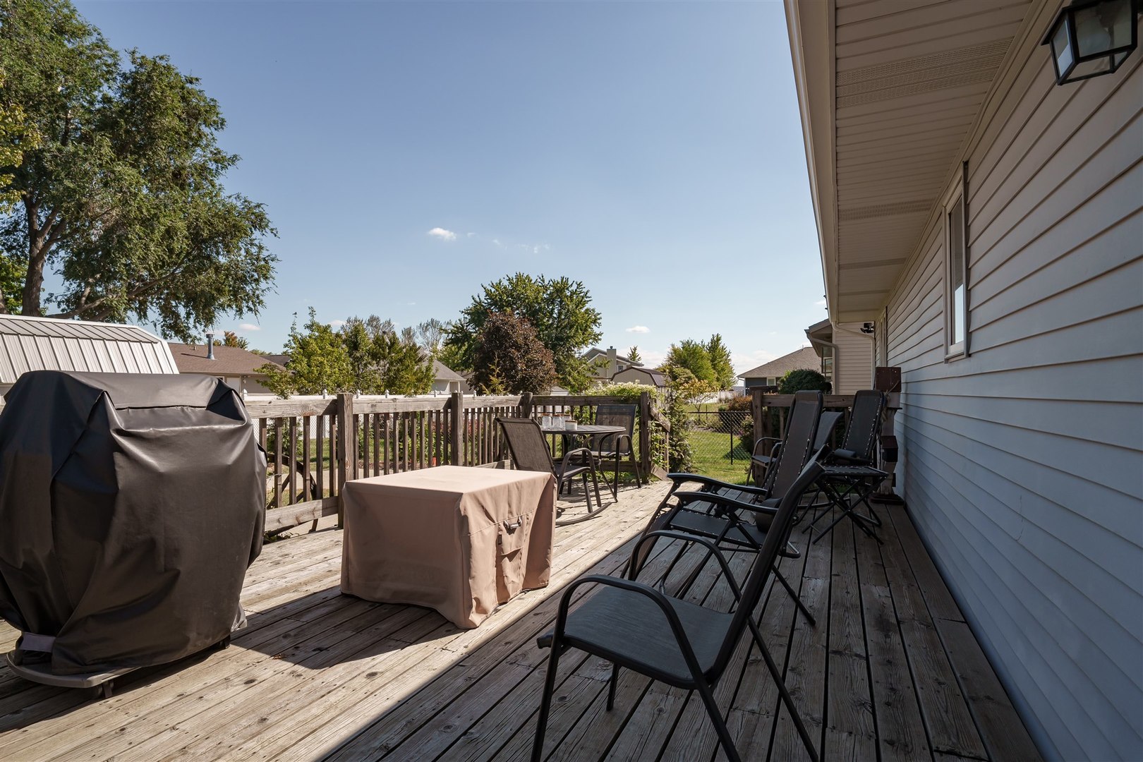 704 Franklin Way Pontiac, IL 61764 - Photo 23 of 39 a view of a roof deck with table and chairs and wooden floor