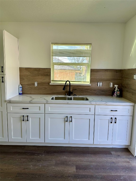 102 Georgia Street Houston, TX 77029 - Photo 5 of 15 a kitchen with granite countertop white cabinets and a sink