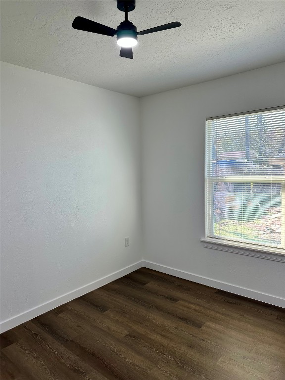 102 Georgia Street Houston, TX 77029 - Photo 7 of 15 an empty room with wooden floor and windows