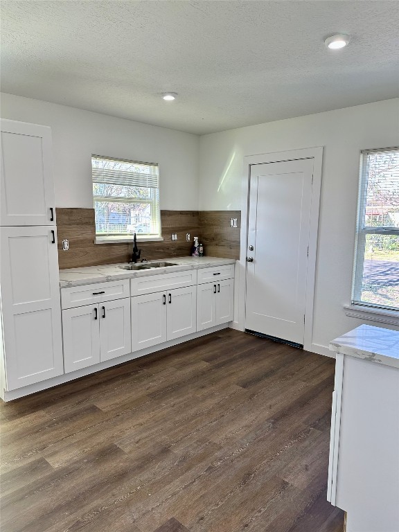 102 Georgia Street Houston, TX 77029 - Photo 9 of 15 a kitchen with granite countertop a sink and a stove top oven