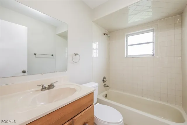 a bathroom with a sink a toilet and bathtub