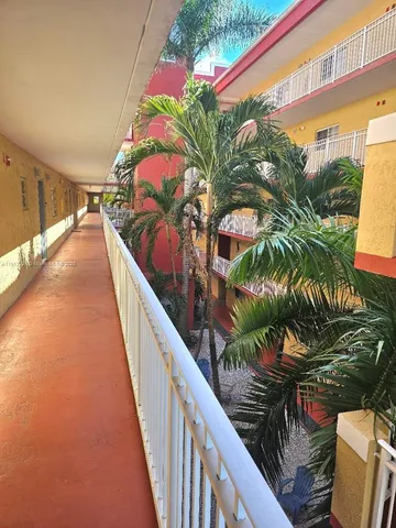 a view of balcony with wooden floor