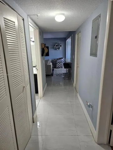 a view of a hallway with workspace