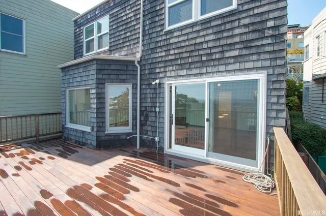 a view of a brick house with a large windows