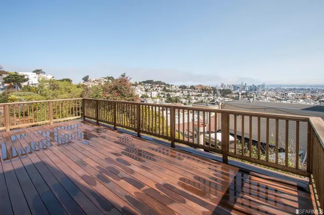 a view of balcony with wooden floor