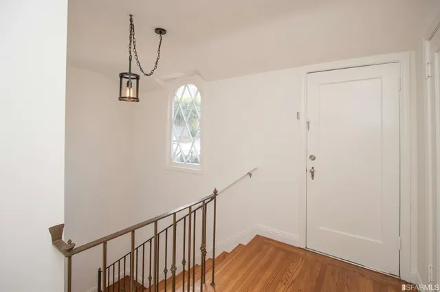 a view of entryway with wooden floor