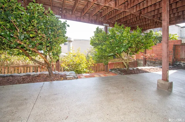 a view of a street with a tree