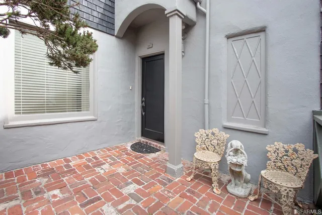 a bedroom with a bed and a chair