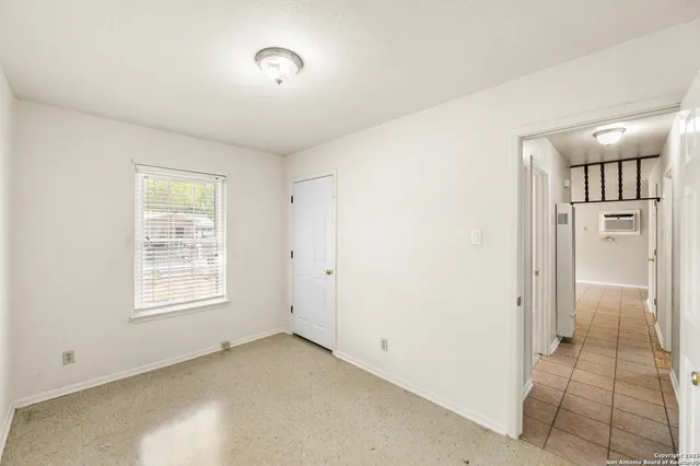 a view of an empty room with a window